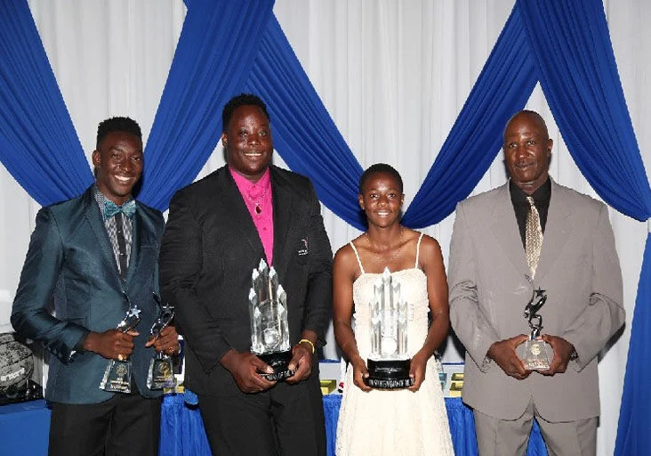 FLASHBACK: Tobago’s 2016 Coach of the Year, Wade “Baby” Franklyn, right, poses with his three winning athletes, from left, Tyriq Horsford (Male Student Athlete of the Year), Akeem Stewart (Sportsman of the Year) and Asha James (Sportswoman of the Year). —Photo: TOBAGO HOUSE OF ASSEMBLY (THA) (Image obtained at trinidadexpress.com)